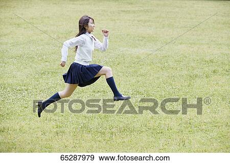 Cute Japanese high school student in a city park View Large Photo Image Stock Photo - Cute Japanese high school student in a city park. Fotosearch