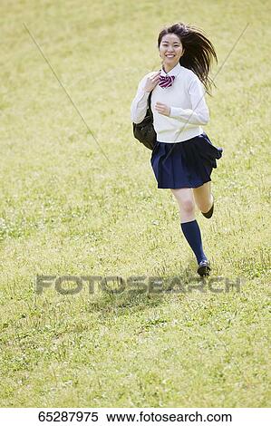 Cute Japanese high school student in a city park View Large Photo Image Stock Photography - Cute Japanese high school student in a city park. Fotosearch