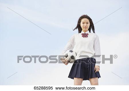 Cute Japanese high school student in a city park View Large Photo Image Stock Photography - Cute Japanese high school student in a city park. Fotosearch