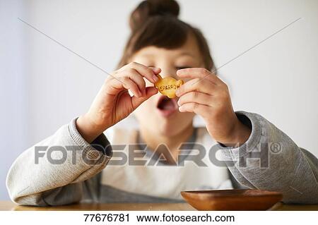 Cute Japanese kid having a snack View Large Photo Image Stock Image - Cute Japanese kid having a snack. Fotosearch