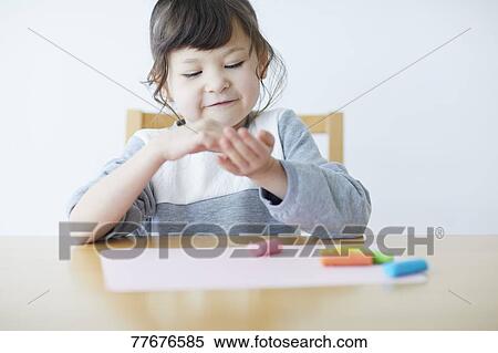Cute Japanese kid playing with clay View Large Photo Image Stock Photography - Cute Japanese kid playing with clay. Fotosearch