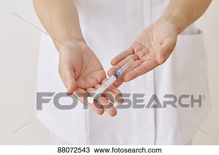 Doctor preparing injection View Large Photo Image Stock Image - Doctor preparing injection. Fotosearch