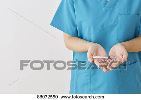 Doctor preparing injection View Large Photo Image Stock Image - Doctor preparing injection. Fotosearch