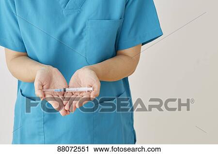 Doctor preparing injection View Large Photo Image Stock Image - Doctor preparing injection. Fotosearch