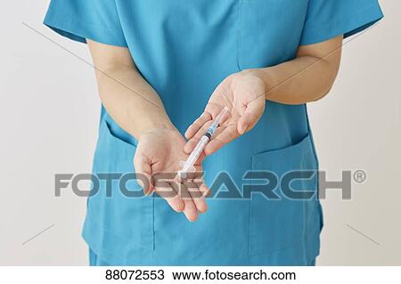 Doctor preparing injection View Large Photo Image Stock Image - Doctor preparing injection. Fotosearch