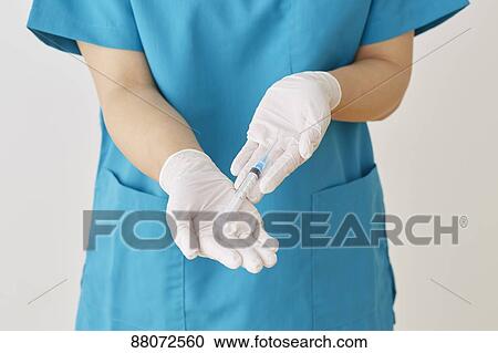 Doctor preparing injection View Large Photo Image Stock Image - Doctor preparing injection. Fotosearch