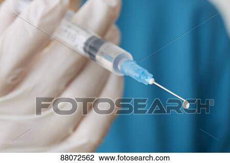 Doctor preparing injection View Large Photo Image Stock Image - Doctor preparing injection. Fotosearch