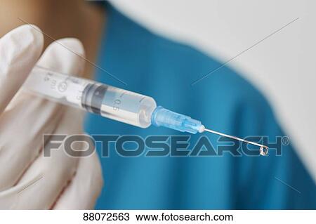 Doctor preparing injection View Large Photo Image Stock Image - Doctor preparing injection. Fotosearch