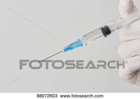 Doctor preparing injection View Large Photo Image Stock Image - Doctor preparing injection. Fotosearch