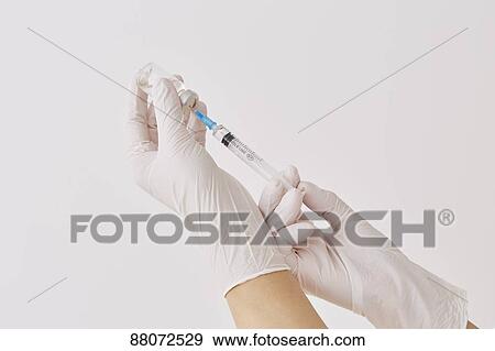 Doctor preparing injection View Large Photo Image Stock Photo - Doctor preparing injection. Fotosearch