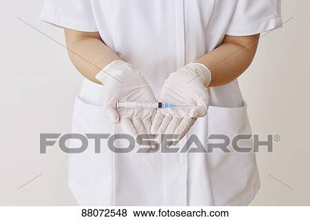 Doctor preparing injection View Large Photo Image Stock Photo - Doctor preparing injection. Fotosearch