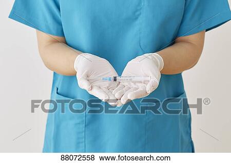 Doctor preparing injection View Large Photo Image Stock Photo - Doctor preparing injection. Fotosearch