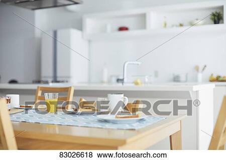 Stock Photo - Empty kitchen during breakfast. Fotosearch