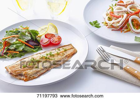 Stock Image - Grilled fish and squid. Fotosearch