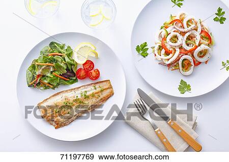 Grilled fish and squid View Large Photo Image Stock Photo - Grilled fish and squid. Fotosearch