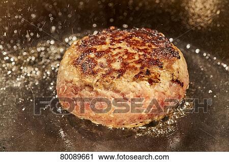 Grilling burg steak View Large Photo Image Stock Image - Grilling burg steak. Fotosearch