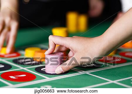 Hand closeup betting on baccarat table View Large Photo Image Stock Image - Hand closeup betting on baccarat table. Fotosearch