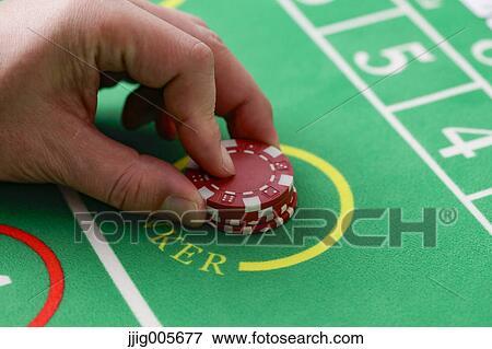 Hand closeup betting on baccarat table View Large Photo Image Stock Photo - Hand closeup betting on baccarat table. Fotosearch