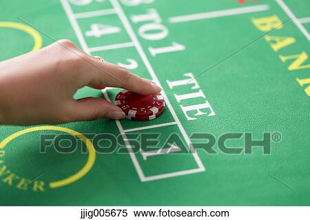 Hand closeup betting on baccarat table View Large Photo Image Stock Photography - Hand closeup betting on baccarat table. Fotosearch