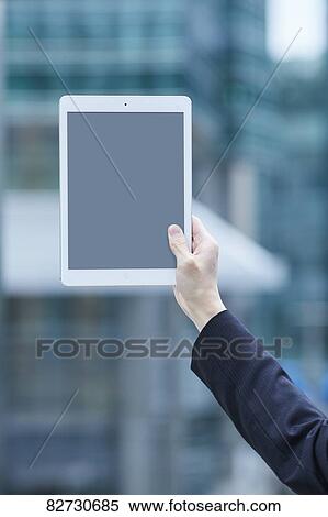 Hand holding tablet downtown Tokyo View Large Photo Image Stock Photography - Hand holding tablet downtown Tokyo. Fotosearch