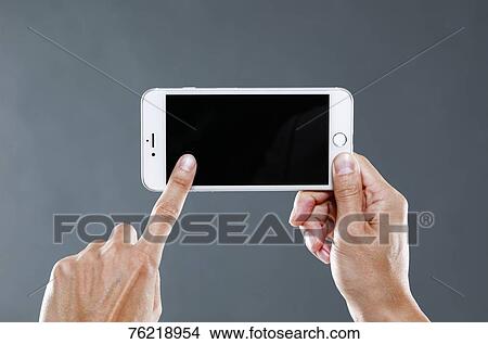 Hands holding smartphone View Large Photo Image Picture - Hands holding smartphone. Fotosearch