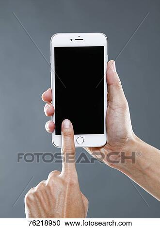 Hands holding smartphone View Large Photo Image Stock Image - Hands holding smartphone. Fotosearch