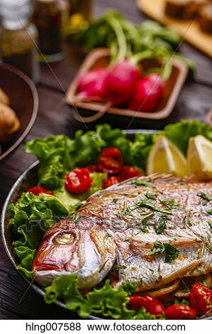 Healty and colorful grilled fish and vegetables View Large Photo Image Stock Photo - Healty and colorful grilled fish and vegetables. Fotosearch