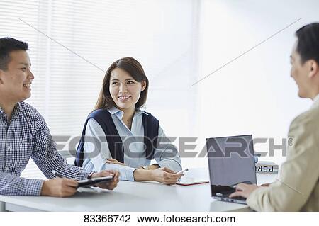 Japanese business people at work View Large Photo Image Stock Image - Japanese business people at work. Fotosearch
