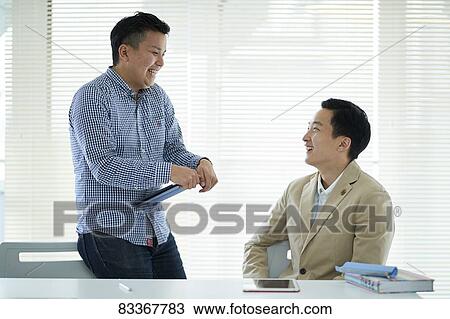 Japanese business people at work View Large Photo Image Stock Image - Japanese business people at work. Fotosearch