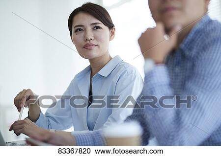 Japanese business people at work View Large Photo Image Stock Image - Japanese business people at work. Fotosearch