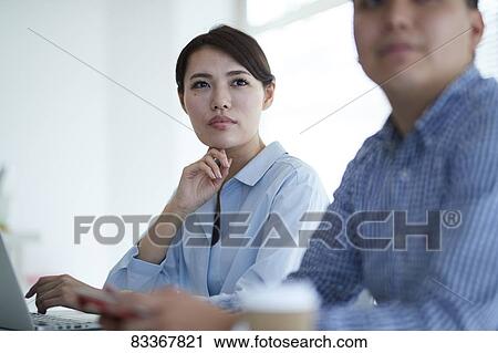 Japanese business people at work View Large Photo Image Stock Image - Japanese business people at work. Fotosearch