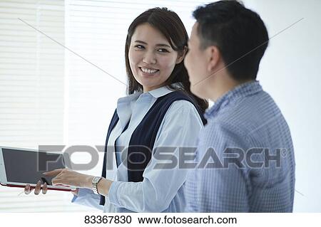 Japanese business people at work View Large Photo Image Stock Image - Japanese business people at work. Fotosearch