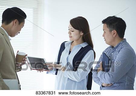Japanese business people at work View Large Photo Image Stock Image - Japanese business people at work. Fotosearch