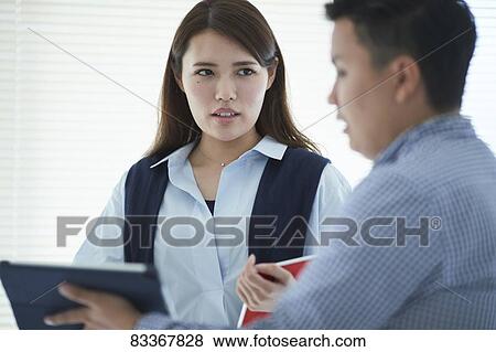 Japanese business people at work View Large Photo Image Stock Photo - Japanese business people at work. Fotosearch