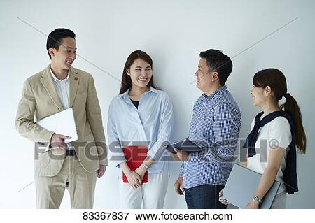 Stock Photo - Japanese business people at work. Fotosearch