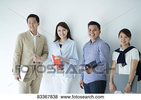 Stock Photo - Japanese business people at work. Fotosearch