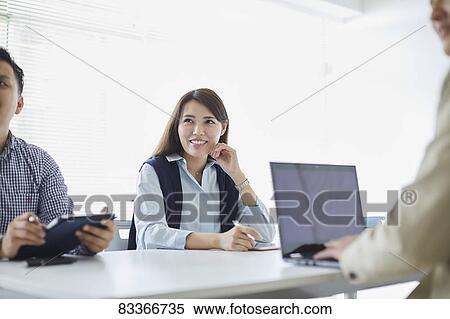 Stock Photography - Japanese business people at work. Fotosearch