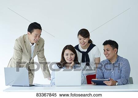 Stock Photography - Japanese business people at work. Fotosearch