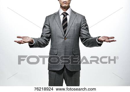 Picture - Japanese businessman against white background. Fotosearch