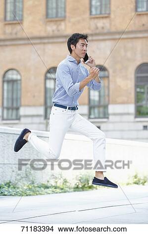Japanese businessman downtown Tokyo View Large Photo Image Picture - Japanese businessman downtown Tokyo. Fotosearch