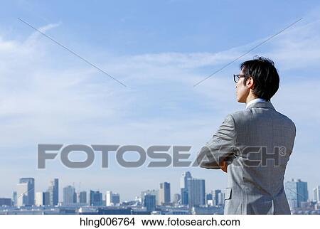 Picture - Japanese businessman downtown Tokyo, Japan. Fotosearch