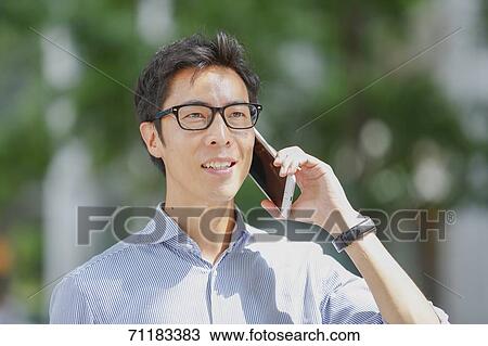 Japanese businessman downtown Tokyo View Large Photo Image Stock Image - Japanese businessman downtown Tokyo. Fotosearch
