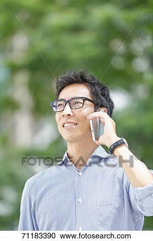 Japanese businessman downtown Tokyo View Large Photo Image Stock Image - Japanese businessman downtown Tokyo. Fotosearch