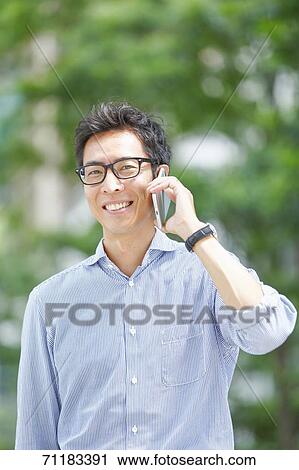 Japanese businessman downtown Tokyo View Large Photo Image Stock Image - Japanese businessman downtown Tokyo. Fotosearch