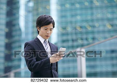 Japanese businessman downtown Tokyo View Large Photo Image Stock Image - Japanese businessman downtown Tokyo. Fotosearch