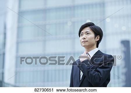 Japanese businessman downtown Tokyo View Large Photo Image Stock Image - Japanese businessman downtown Tokyo. Fotosearch