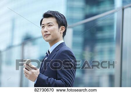 Japanese businessman downtown Tokyo View Large Photo Image Stock Image - Japanese businessman downtown Tokyo. Fotosearch