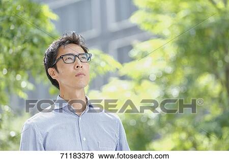 Japanese businessman downtown Tokyo View Large Photo Image Stock Photo - Japanese businessman downtown Tokyo. Fotosearch