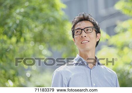 Japanese businessman downtown Tokyo View Large Photo Image Stock Photo - Japanese businessman downtown Tokyo. Fotosearch