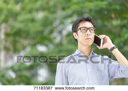 Japanese businessman downtown Tokyo View Large Photo Image Stock Photo - Japanese businessman downtown Tokyo. Fotosearch